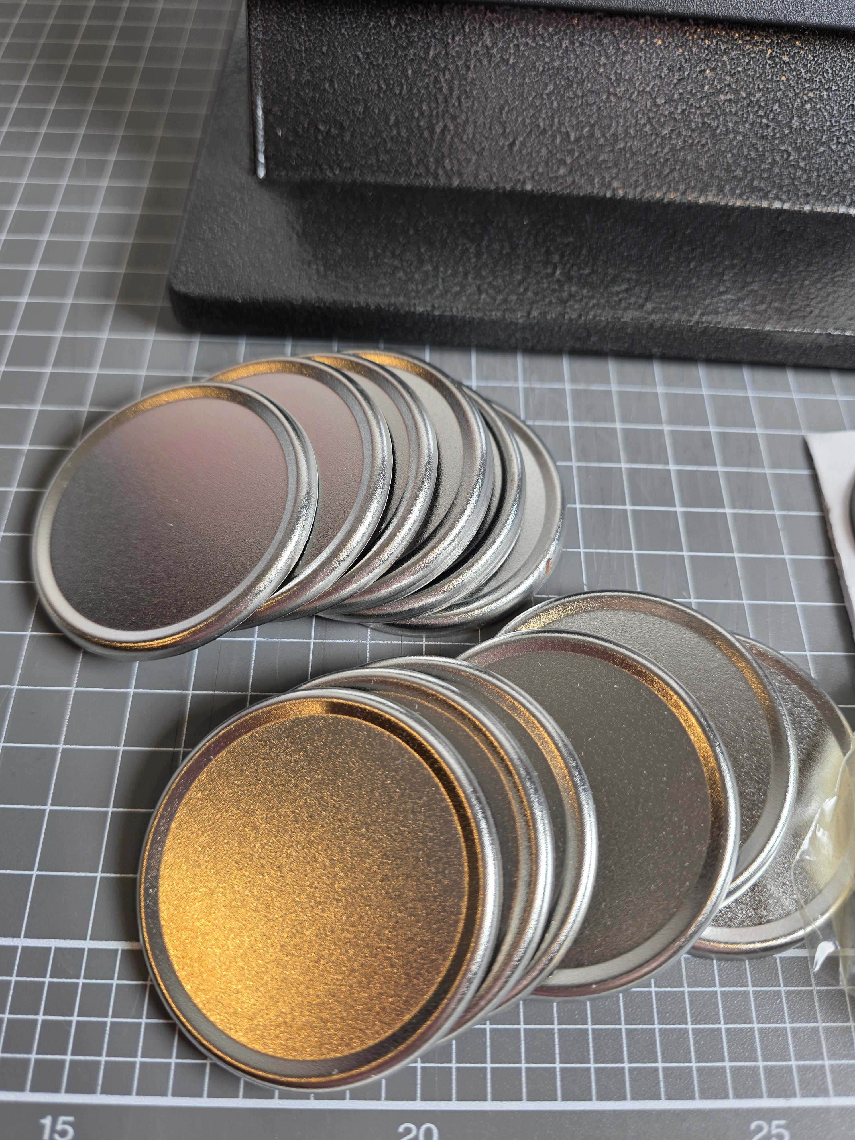 Stack of metallic circular objects on a grid surface