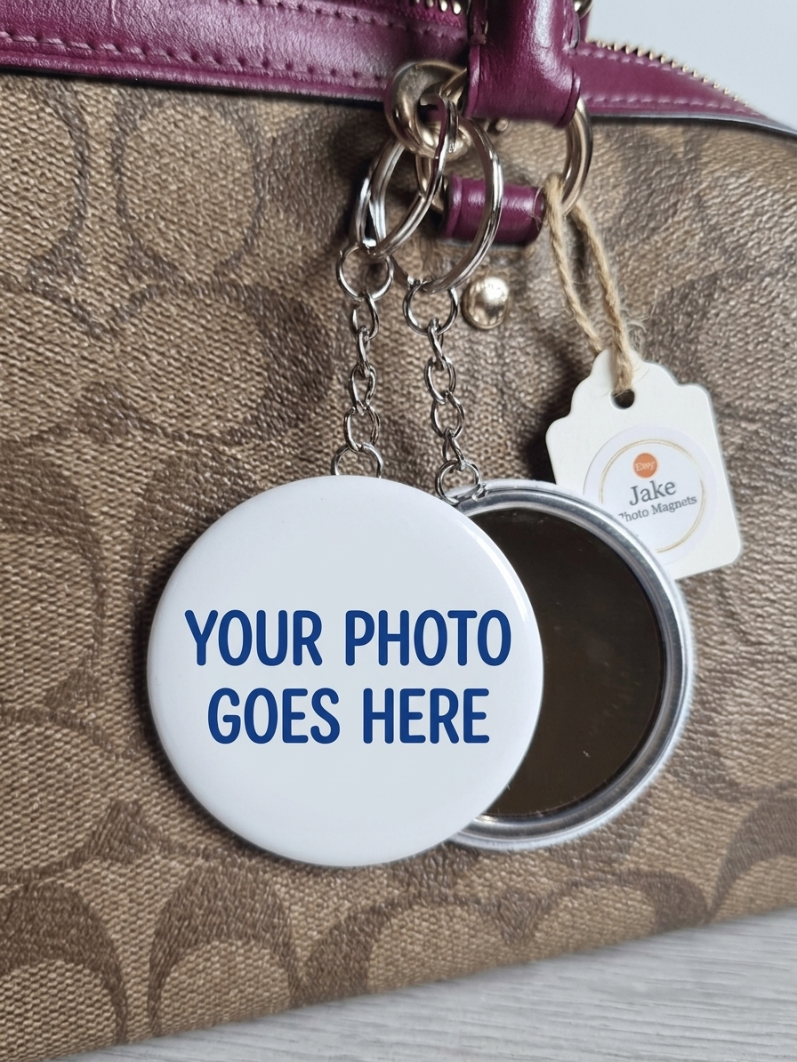 Round photo key ring frame with 'Your photo goes here' text on a textured surface