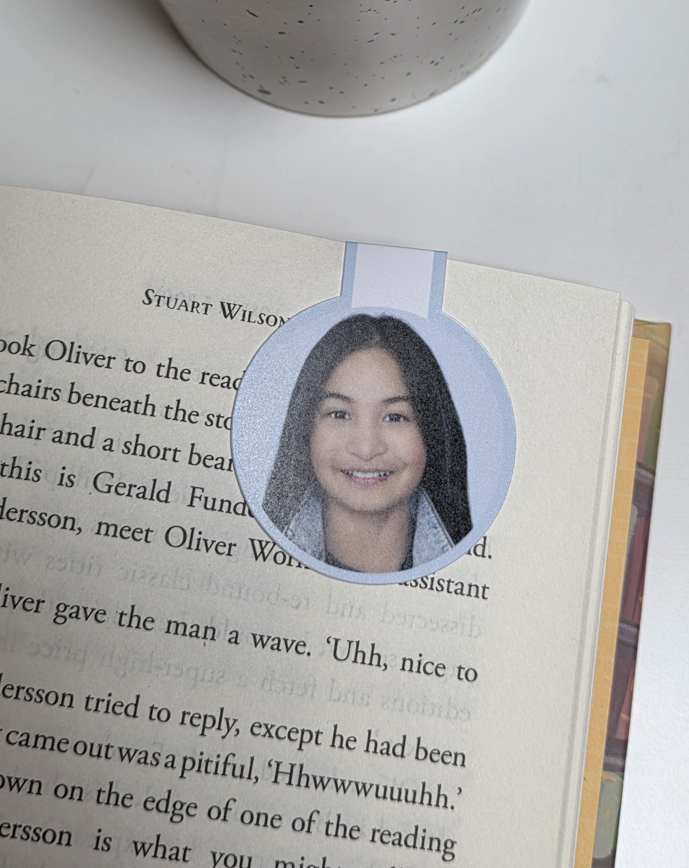 Book with a circular photo of a person on a page